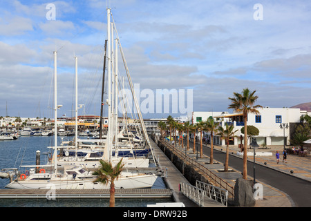 Waterfront and harbour with luxury boats in modern development of Marina Rubicon, Playa Blanca, Lanzarote, Canary Islands, Spain Stock Photo