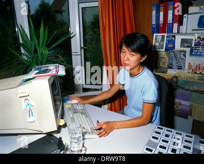 Chinese Woman On Computer Stock Photo