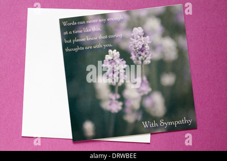 With Sympathy card and envelope isolated on pink background Stock Photo