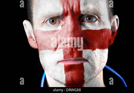 Aggresive football fan with their face painted with the English flag. Stock Photo