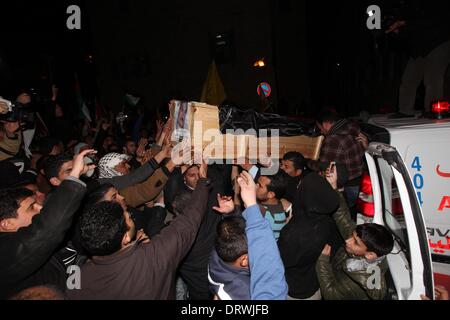 Bethlehem, Jerusalem 13 years ago. 2nd Feb, 2014. Palestinians carry the coffin of Daoud Abu Swai, who blew himself up in Jerusalem 13 years ago, after the Israeli authorities handed over his body in the West Bank city of Bethlehem on Feb. 2, 2014. Israel will transfer 36 bodies to the West Bank for reburial following a Supreme Court ruling. Credit:  Luay Sababa/Xinhua/Alamy Live News Stock Photo