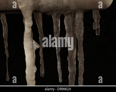 Icicles hanging from car. Stock Photo