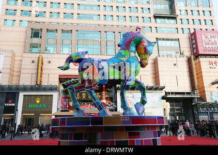 (140203) -- BEIJING, Feb. 3, 2014 (Xinhua) -- Photo taken on Feb. 2, 2014 shows a horse-shaped festival lantern in front of a shopping mall on Wangfujing Street, a commercial area in Beijing, capital of China. The Lunar New Year, or Spring Festival, begins on Jan. 31 and marks the start of the Year of the Horse, according to the Chinese zodiac. (Xinhua)(wjq) Stock Photo