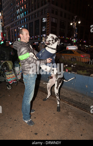 A Seattle Seahawks fan wearing a Russell Wilson jersey waves a