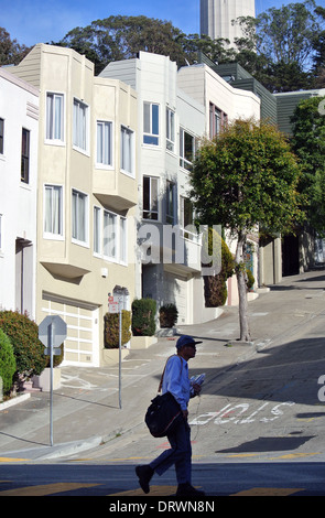 postman delivering mail on steep hill in San Francisco Stock Photo