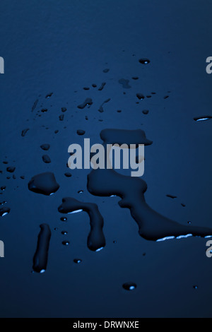 High angle view of water droplets on a red surface Stock Photo - Alamy