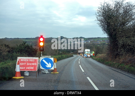 Temporary traffic lights at roadworks on a road in the UK Stock Photo ...