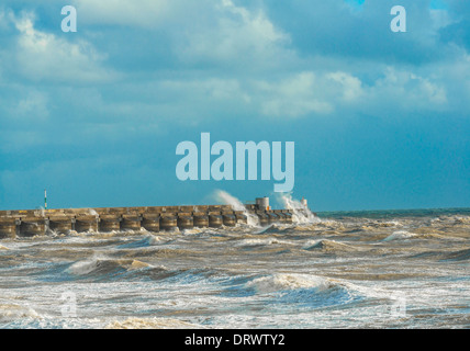 Stormy seas breaking over Brighton Marina, Sussex, UK Stock Photo