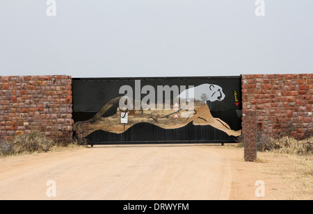 Prancing leopard entrance gate to the Africa leopard and cheetah reserve in Namibia,Africa. Stock Photo
