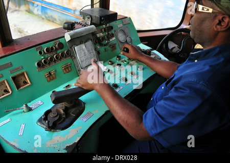 Cuba: part of the Hershey Electric Railway running between Havana and Matanzas. Driver at the controls. Stock Photo