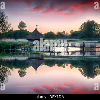 Hut Test Traditional fishing hut at sunset on Tharon beach at high tide in Saint ...