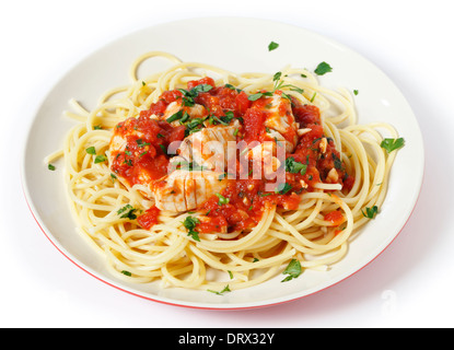 Spaghetti all'arrabbiata with fish, garnished with parsley. The sauce is made from tomato, garlic, olive oil and flaked chillis. Stock Photo
