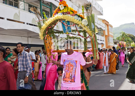 A devotee of Lord Muruga carrying a decorative cavadee during the Thaipoosam Cavadee religious festival, Mauritius. Stock Photo