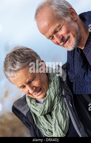 happy senior couple elderly people together outdoor in autumn winter Stock Photo