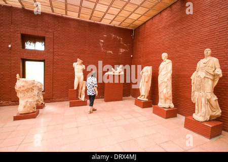 ASIA, Turkey, Selçuk, Ephesus Museum, room full of statues plus tourist Stock Photo