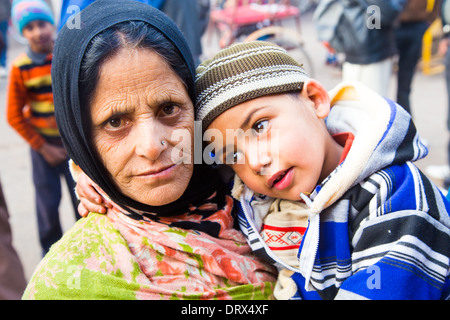 Muslim grandmother and young boy, Old Delhi, India Stock Photo
