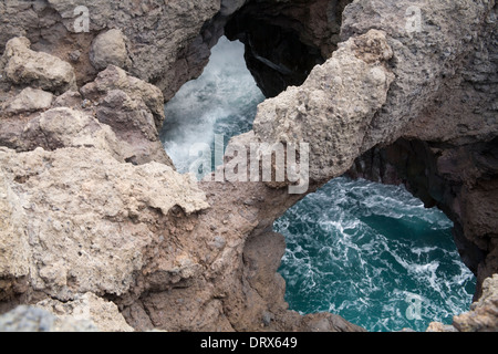 Los Hervideros Boiling Springs Lanzarote Wild Atlantic rollers pounding into sea caves in volcanic lava Stock Photo
