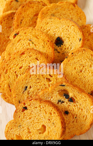 Small round toasts with black olives Stock Photo