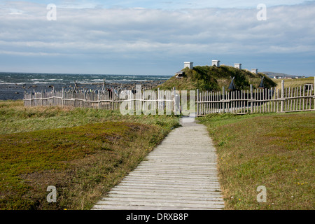 Canada, Newfoundland, L'Anse aux Meadows National Historic Site. Coastal view of park boardwalk to reconstructed village. Stock Photo