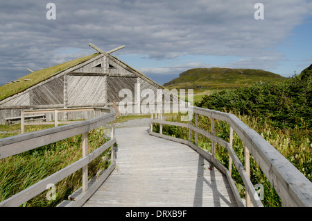 Canada, Newfoundland, L'Anse aux Meadows. Norstead Viking Village, wooden boardwalk to recreated boat house. Stock Photo
