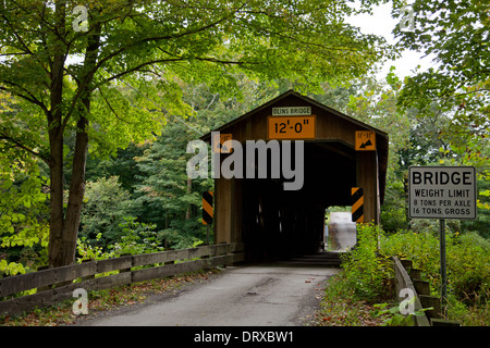 Built in 1873, this 115-foot-long covered bridge spans the Ashtabula River in Plymouth Township, Ohio. Stock Photo