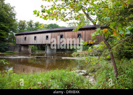 Built in 1873, this 115-foot-long covered bridge spans the Ashtabula River in Plymouth Township, Ohio. Stock Photo