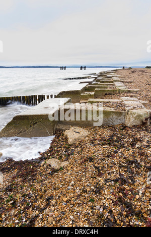 Concrete remains of phoenix breakwater caissons. Lepe Beach, Hampshire, England, United Kingdom. Stock Photo