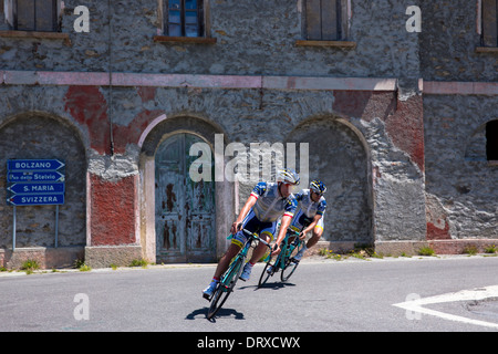 Cyclists ride Bianchi roadbikes on The Stelvio Pass, Passo dello Stelvio, Stilfser Joch, in Northern Italy Stock Photo