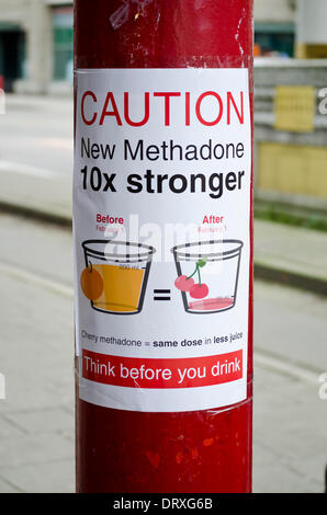 VANCOUVER, BC, CANADA - February 2, 2014.  In the Downtown Eastside neighbourhood of Vancouver, a sign warns methadone users that as of February 1, 2014, the formula being administered is 10 times stronger than the previous one.  The change to a new formula, called Methadose, was created by the Provincial Ministry of Health.  Methadone is a pharmaceutical drug used to treat addiction to heroin and other opioid drugs.  The Ministry stated that warning posters were being installed throughout the province to inform users who may be unaware of the potency change. Stock Photo
