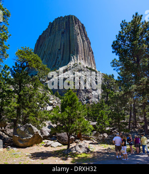 Walkers on Tower Trail beneath Devils Tower National Monument, Crook County, Black Hills, Wyoming, USA Stock Photo