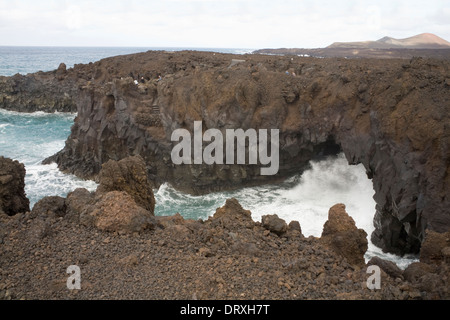 Los Hervideros Boiling Springs Lanzarote Wild Atlantic rollers pounding into sea caves in volcanic lava walkways  viewing points Stock Photo