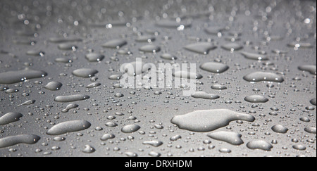 Water droplets on shiny metal surface Stock Photo