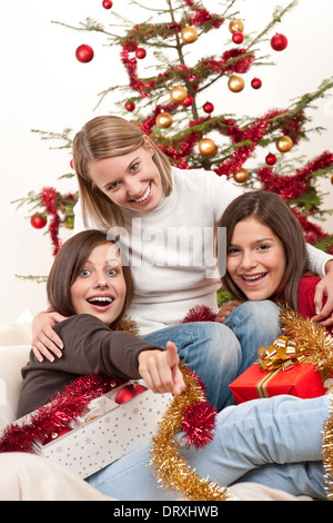 Three young women having fun on Christmas Stock Photo