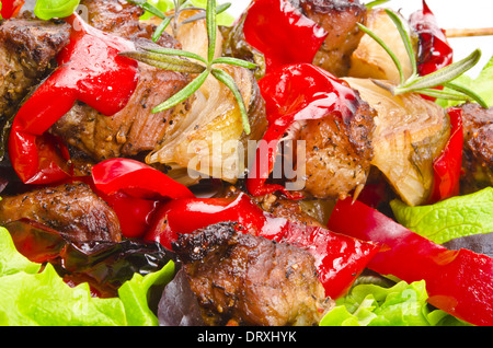 Meat spit with fried potatoes Stock Photo