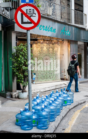 Bonaqua mineral water bottles lined up in Wyndham Street in the centre of old Hong Kong Stock Photo