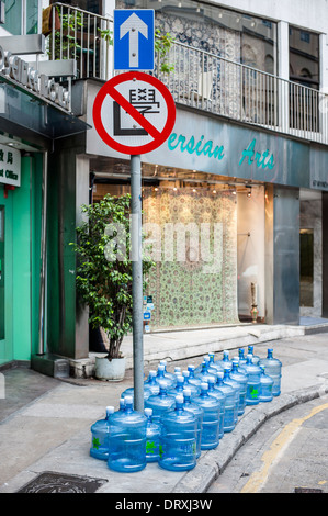 Bonaqua mineral water bottles lined up in Wyndham Street in the centre of old Hong Kong Stock Photo