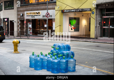 Bonaqua mineral water bottles lined up in Wyndham Street in the centre of old Hong Kong Stock Photo