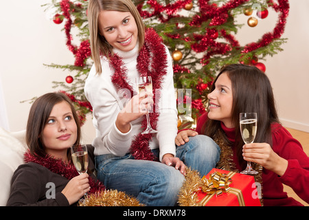 Three young women having fun on Christmas Stock Photo