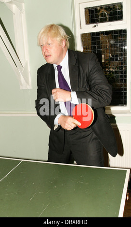 London Mayor Boris Johnson plays table tennis during a visit to a new youth centre in Brixton Stock Photo