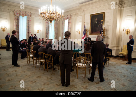 US President Barack Obama and Vice President Joe Biden meet with Senate Minority Leader Mitch McConnell and the Senate Republican Conference to discuss the government shutdown and debt limit deadline in the State Dining Room of the White House October 11, 2013 in Washington, DC. Stock Photo