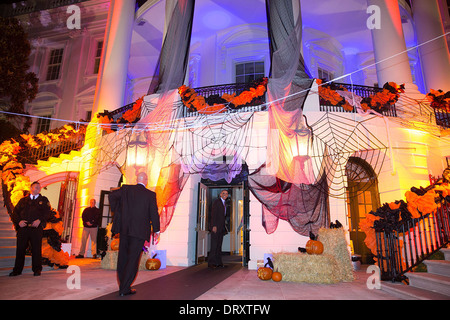 US President Barack Obama checks out the Halloween decorations as he enters the South Portico of the White House October 30, 2013 in Washington, DC. Stock Photo