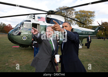 US President Barack Obama is met by Senator Chuck Schumer upon arrival aboard Marine One at the Prospect Park landing zone October 25, 2013 in New York, NY. Stock Photo