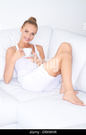 Beautiful elegant woman drinking coffee Stock Photo