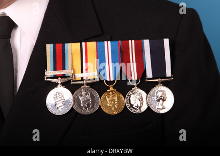 British military campaign medals for Afghanistan on left and Iraq second left on a Royal Navy uniform Stock Photo