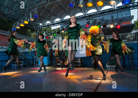 The Irish Dance Ensemble CEILI performs traditional Irish dances on a stage. Stock Photo