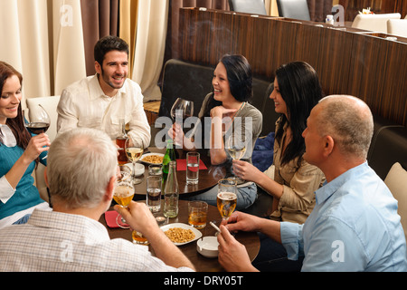 Drink after work happy colleagues having fun Stock Photo