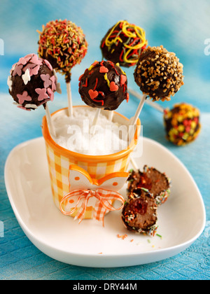Chocolate cake pops with cherries. Recipe available. Stock Photo