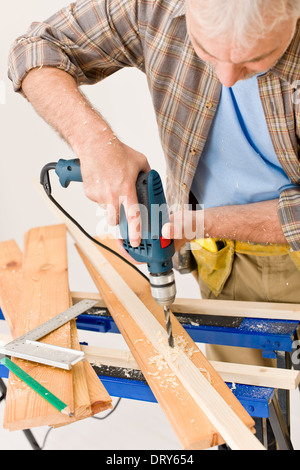 Home improvement - handyman drilling wood Stock Photo