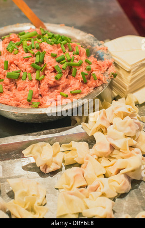 making of wonton, a kind of chinese dumplings. Photo is taken at Hubu lane snack street in Wuhan, China. Stock Photo