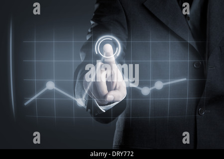 Businessman navigating data in chart on futuristic touchscreen display Stock Photo